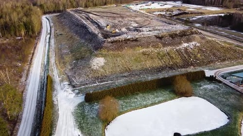 Aerial flyover landfill full of trash, pollution environmental problem, garbage, trucks dump waste p