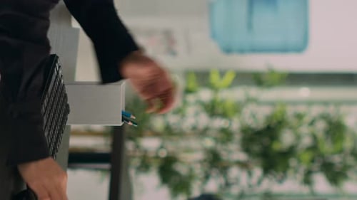 Woman Typing at Desk in a Modern Office
