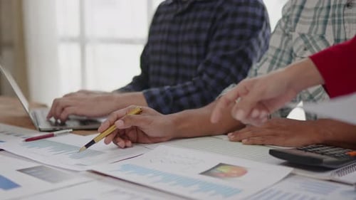 Close up of hands are working and brainstorming on paperwork about business financial and marketing.