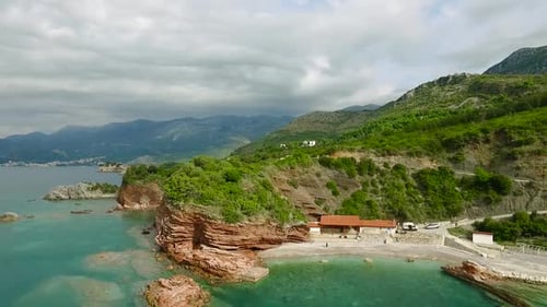 A Stunning Seaside View with Rocky Shores and Lush Greenery Showcasing Natures Beauty