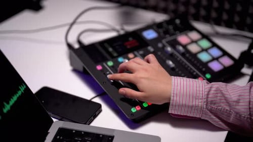 Close Up of Operating a Soundboard in Acoustic Studio