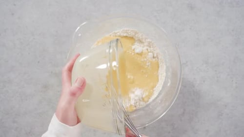 Batter Being Mixed in a Bowl with a Whisk