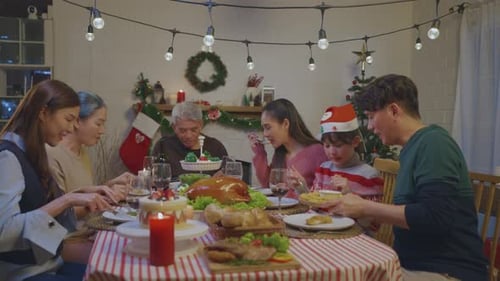 Family Gathering for Christmas Dinner Celebration Indoors