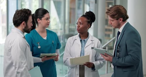 Tablet, discussion and team of doctors and nurses in hospital for medical diagnosis