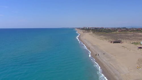 Aerial establishing shot of the beaches and tropical waters in Turkey