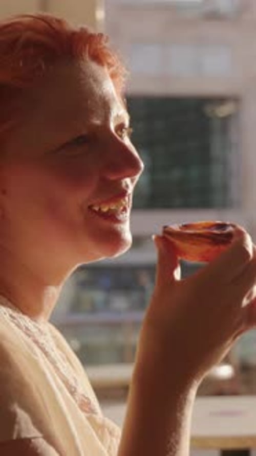 Young Adult Eats Pizza Slice Indoors Close Up