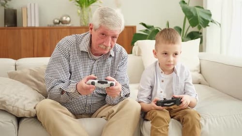 Grandfather and Grandson Play Video Games
