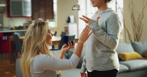 Happy Couple Celebrates Engagement Proposal at Home