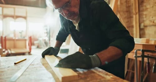 Man, wood and sanding in workshop, carpenter and manufacturing furniture