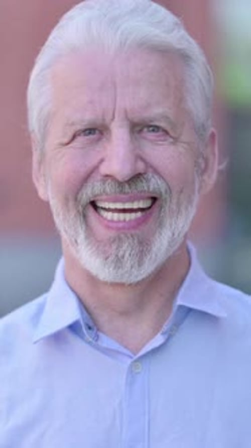Man Smiling Directly at Camera in Portrait Video