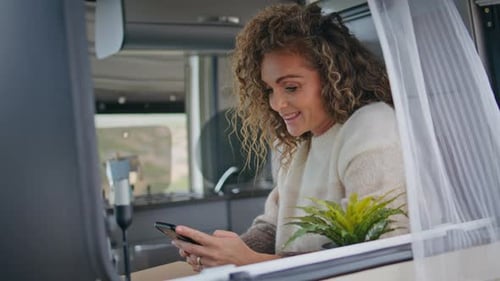 Positive Woman Texting Mobile Phone in Campsite Close Up Smiling Lady Watching