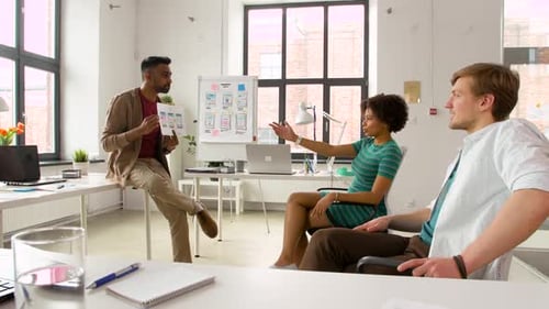 Business, Technology and Software Development Concept - Man Showing User Interface Mockup