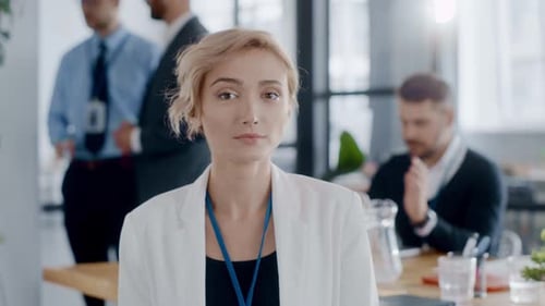 Smiling businesswoman in bright office setting