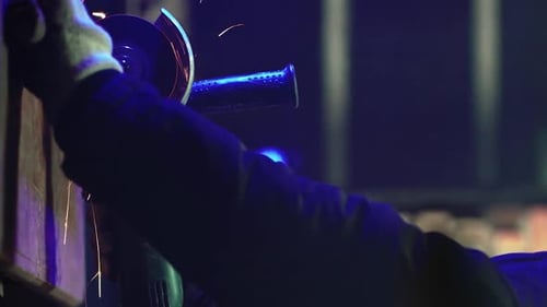 Professional Worker Works in Production with Metal