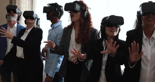 Multiracial Teamwork Having Fun Wearing Virtual Reality Headset Inside Bank Office
