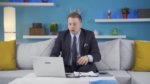 Home office worker man shocked by what he reads and sees.