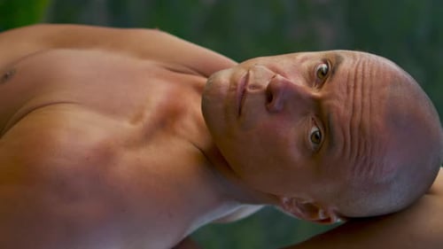 Handsome Man Stretching Arms Training Closeup. Focused Muscular Guy Practicing Hand Lock