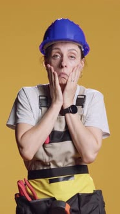 Vertical Video Portrait of Sleepy Tired Handywoman Working on Construction