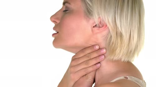 Woman Massaging Sore Throat in Close Up