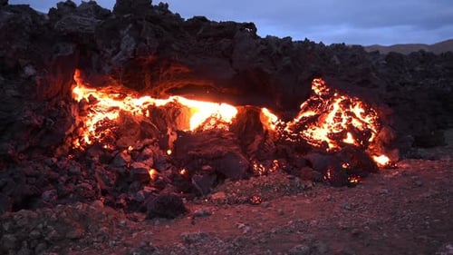 Hot lava and magma erupt from active volcanic crater in Iceland, creating dramatic display of molten