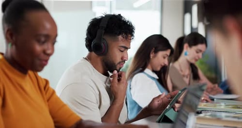 Man, student and thinking with tablet on campus for education, study and listening to music