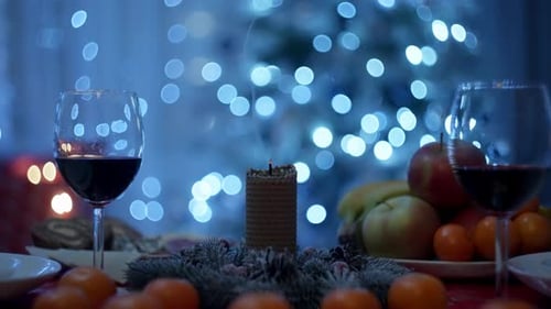 Festive Holiday Table with Candle and Wine