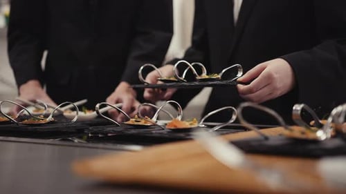 Waiters serving food at a restaurant