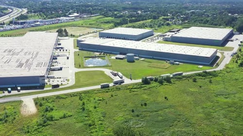 Aerial view of warehouse storages or industrial factory or logistics center from above. Aerial view