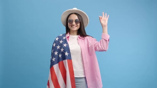 Smiling Woman with American Flag and Sunglasses