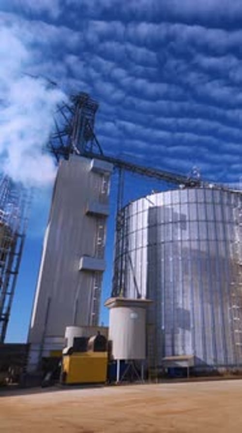 Large Grain Bins. Modern Granary elevator. Agribusiness. Vertical video