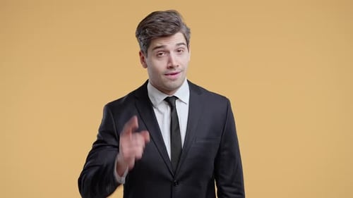 Smart Businessman Points to Head Taps Temple Suggesting Smart Thinking or Idea