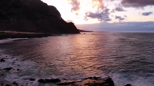 Aerial Sunset Light Over Ocean and Volcanic Cliffs of Tenerife Canary Island