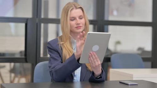 Young Businesswoman Using Digital Tablet