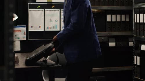 Detective Arriving in Office with Laptop