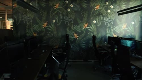 Empty office room after working day with lights off. Stock footage. Modern office with computers