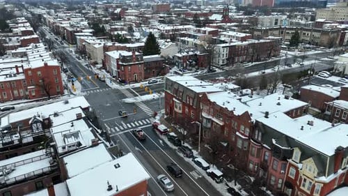 Historic district of American city covered in snow during winter. Aerial.