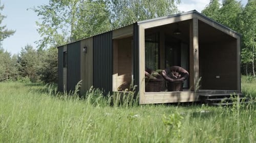Compact Wooden Home in a Rural Field