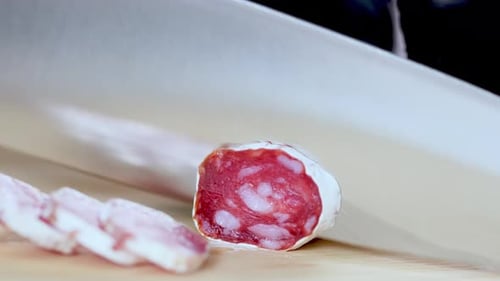 Salami Sliced Fresh on a Wooden Board