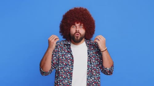 Man Expressing Joy and Surprise With Curly Hair