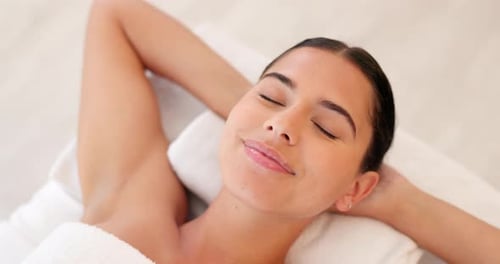 Spa, wellness and woman, calm and happy, peaceful after massage, massage therapy for body health