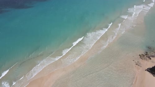 aerial drone shot of a beautiful beach with clear water in Fuerteventura in the Canary Islands