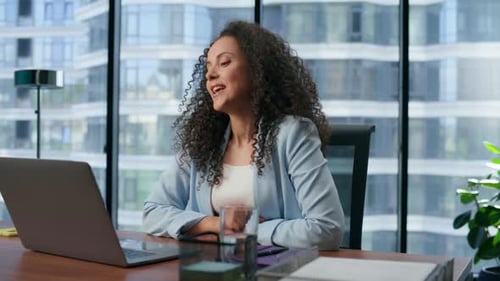 Woman on Video Call in Bright Modern Office