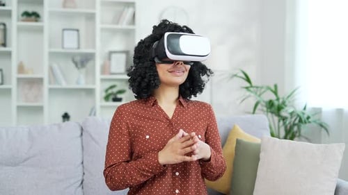 Woman Experiencing Virtual Reality Headset at Home