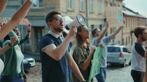 Group Demonstrates with Signs and Megaphone in City