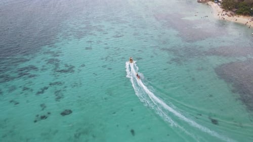 Aerial view of speedboat in shallow water. Travel and leisure activities concept
