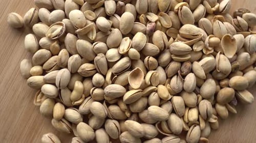 Food background. Roasted pistachio nuts seed with shell close up. Dieting concept