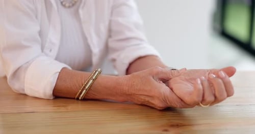Senior Woman Massaging Her Sore Wrist Joint