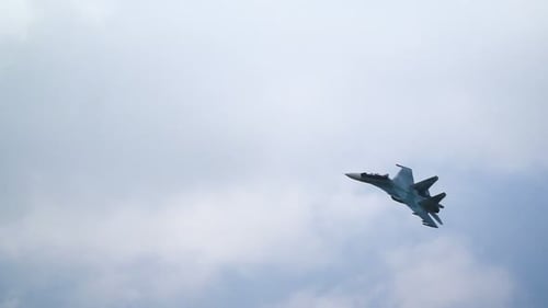 Sukhoi su30 fighter plane performing aerobatic maneuvers in slow motion over Russia