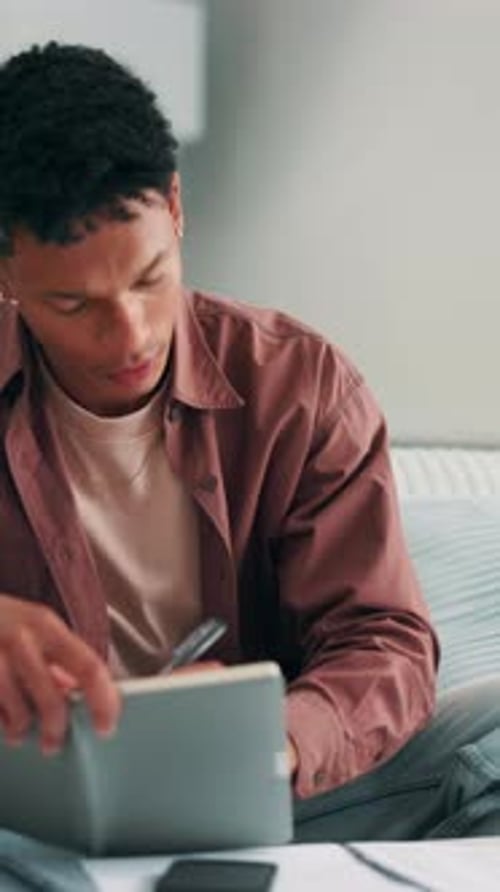 Man, student and writing with notebook in home for accounting course, finance or budget planning