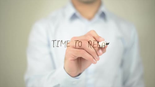 Man Writes Time to Relax on Clear Surface